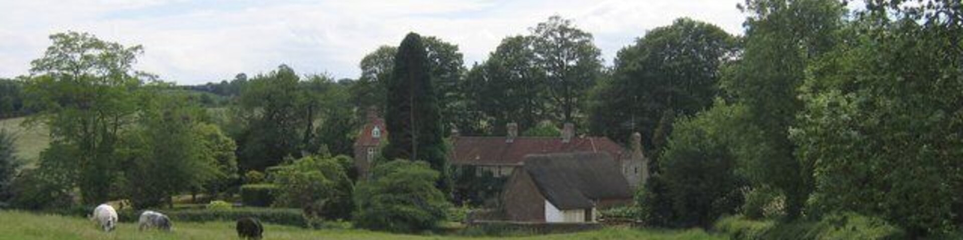 Epwell Mill. Seen across the fields from the bend in the lane to Epwell.