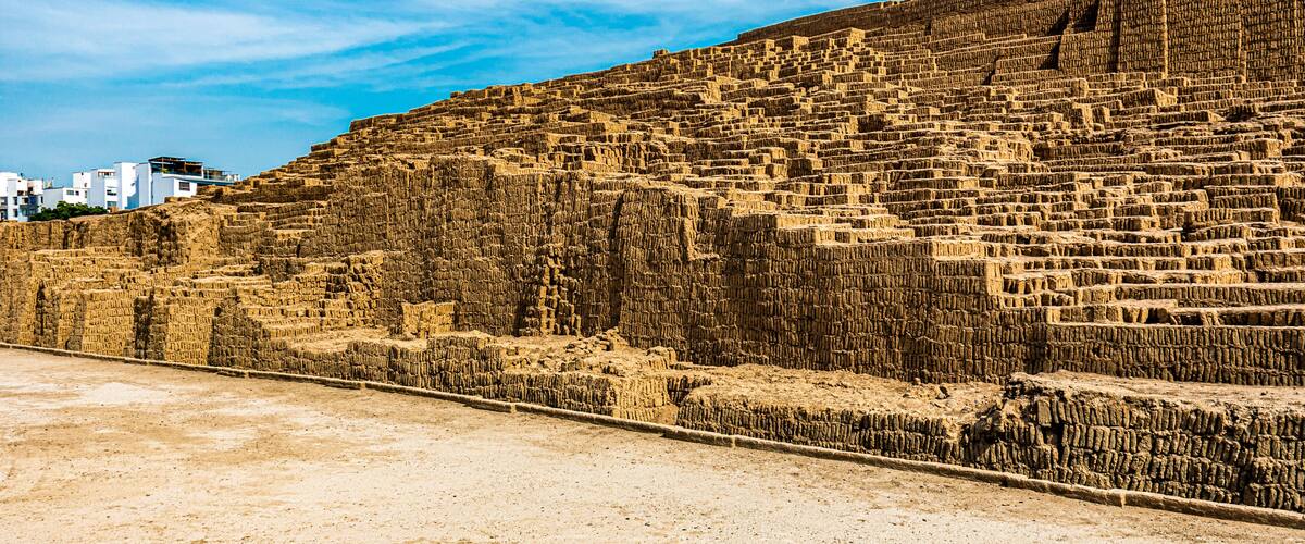 A large terraced structure with a clear sky.