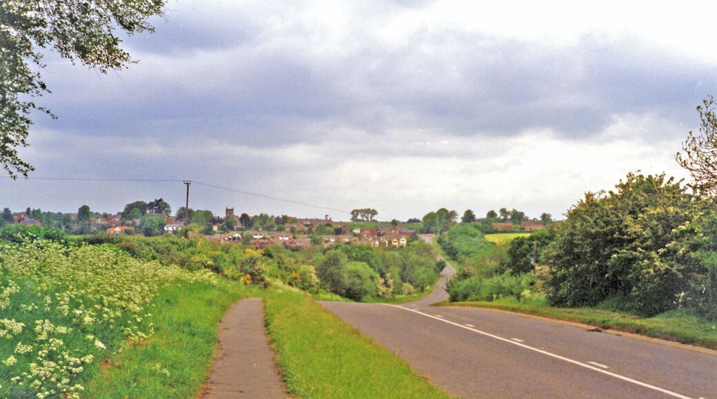 Site of Heather & Ibstock station. View westward, towards Heather on the B591 from Ibstock: the station had been in the dip ahead. It was on the ex-LNWR & Midland Joint (Ashby & Nuneaton) line from Nuneaton via Shackerstone (to left) to Coalville and Loughborough (right), the Charnwood Forest line. The station closed 13/4/31, but the line remained for goods until 7/10/63.