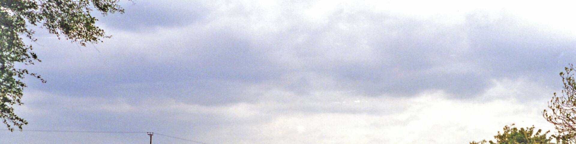 Site of Heather & Ibstock station. View westward, towards Heather on the B591 from Ibstock: the station had been in the dip ahead. It was on the ex-LNWR & Midland Joint (Ashby & Nuneaton) line from Nuneaton via Shackerstone (to left) to Coalville and Loughborough (right), the Charnwood Forest line. The station closed 13/4/31, but the line remained for goods until 7/10/63.