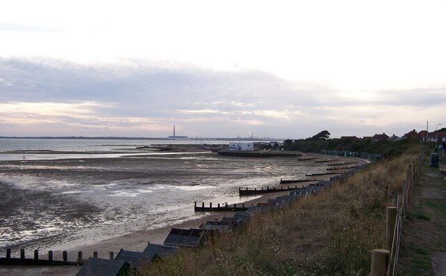 Beach Huts -Hill Head Beach Huts at Hill Head. Fawley Power Station and Oil Refinery can be seen in the background.