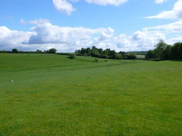 Lake, Thornford, Dorset Lake is a small cluster of houses round Lake Farm. The lake it refers to is more of a large pond. This is the view north east towards Lake and Lake Farm from halfway between lake and the start of Thornford.