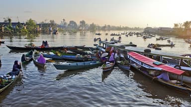 Banjarmasin, July 2022. Busy Lok Baintan floating market in the morning. Merchants offer their wares to tourists