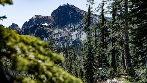Female mountain biker on ridge