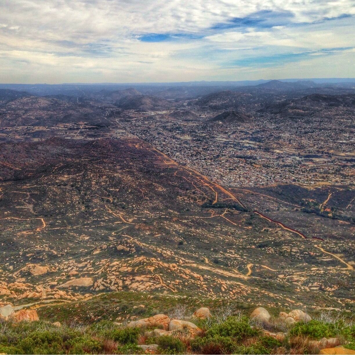 The border from Tecate Peak. The city of Tecate, Mexico is on the right side. The white towers in the center if town is the Tecate Brewery. I'm a fan!