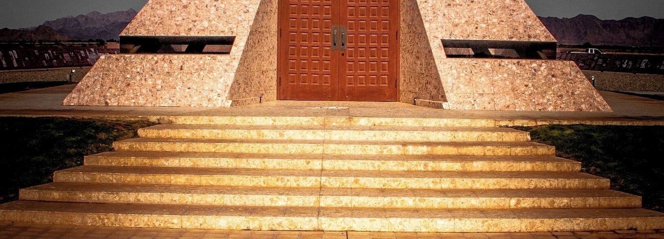 According to the French government and California’s Imperial County, the official center of the world lies in the town of Felicia in California’s Sonora Desert. There is no scientific or political reason for the designation, but only the effort of Jacques-André Istel and his wife Felicia Lee (the town's namesake), who founded the town in 1986. Jacques-André made his name and fortune as a famous French-American parachutist and co-founded of Parachutes, Inc., which produced parachuting equipment and opened the first parachuting school in the United States. He is credited as a key figure in popularizing parachuting in America and has been referred to as the “father of American skydiving.” In 1985 he wrote the children’s book "Coe: The Good Dragon at the Center of the World" about a dragon that lived at the center of the world, which served as the inspiration behind the town’s creation