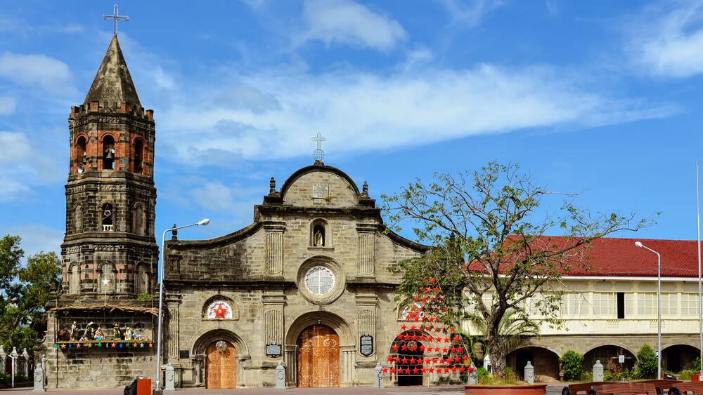 A historic church with a bell tower and a large dome.