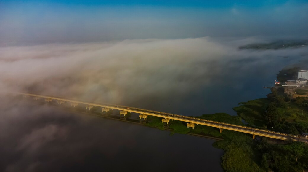 Aerial view of the beautiful Lower Volta Bridge over a foggy river landscape, Sogakope, Ghana.