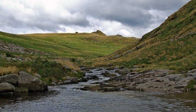 Looking up the river Tavy into Tavy Cleave, Devon The walk as far as this is easy, along the track from Lane End, beside the leat. Just out of sight in the middle is a small locked building and weir - from which the leat water is extracted. From there on the walking gets rougher - but it is a great adventure to go on up the cleave. We swam in the pool from which this picture was taken. (Yes, it was cold...)