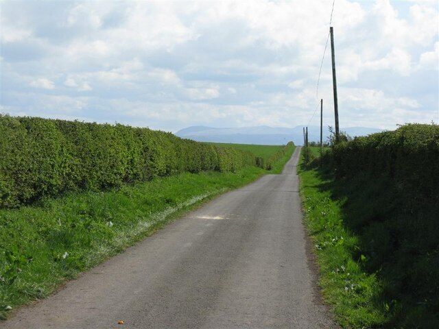 The road to Dornock Brow Keep right on to the end of the road and you could end up at Skiddaw in the Lake District, which is visible in the distance. Just the Solway Firth to negotiate, which would be about 2.5km wide at this point at high tide.