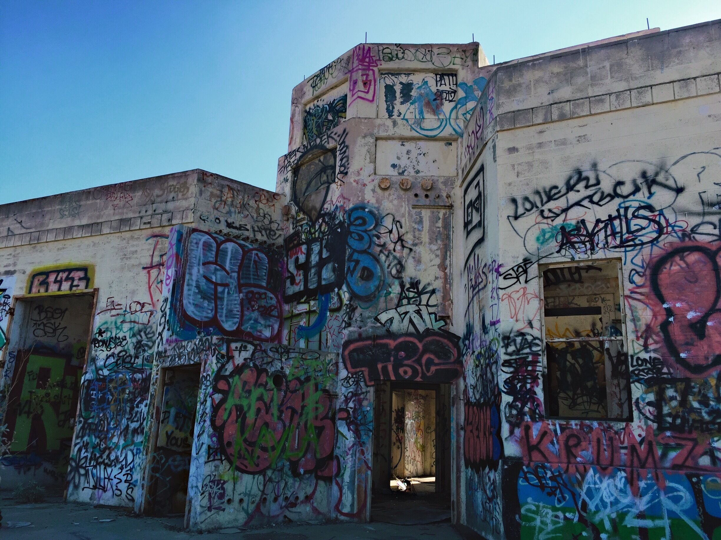 A building covered in colorful graffiti.