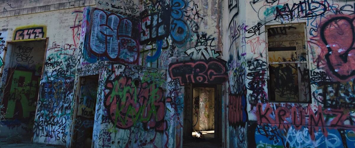 A building covered in colorful graffiti.