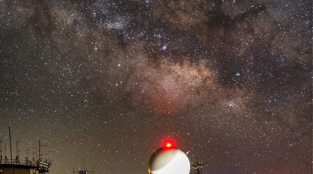 The core of the Milky Way rises above the dome of the FAA radar dome