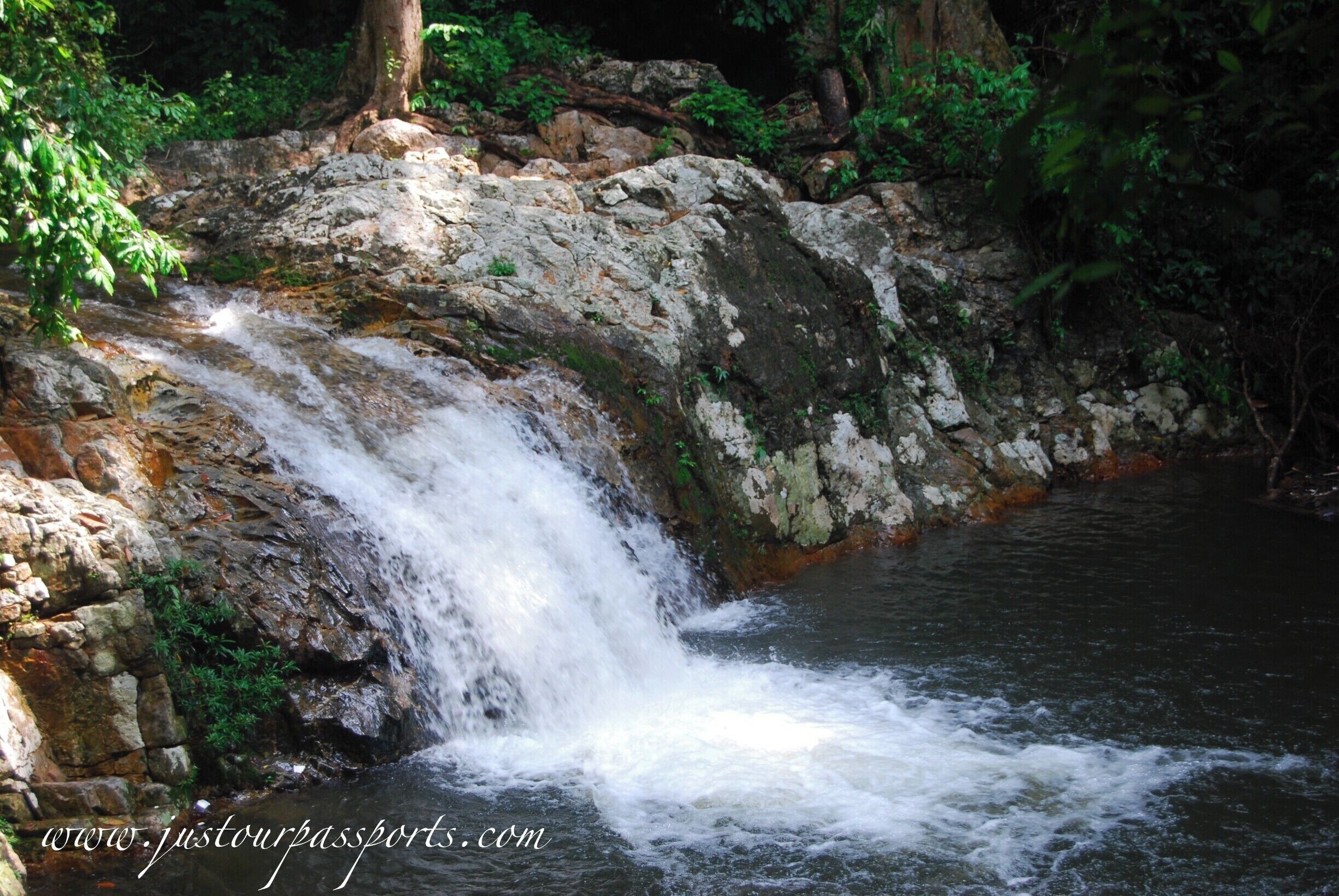 This park is in Lenggong Valley off of 76. There is a very small sign off the main road that leads you down a partially paved road that looks like someone's driveway. We did it in a small car without four-wheel drive so any car should make it. At the end of the road is a big parking lot where you can leave your vehicle for free. Walk up the paved path until you get to the waterfalls. There are more farther up but the bridge has fallen in - a little adventure through a stream never hurt anyone though! Lots of locals visit the pools on weekends so go during the week if you want a quieter experience. 