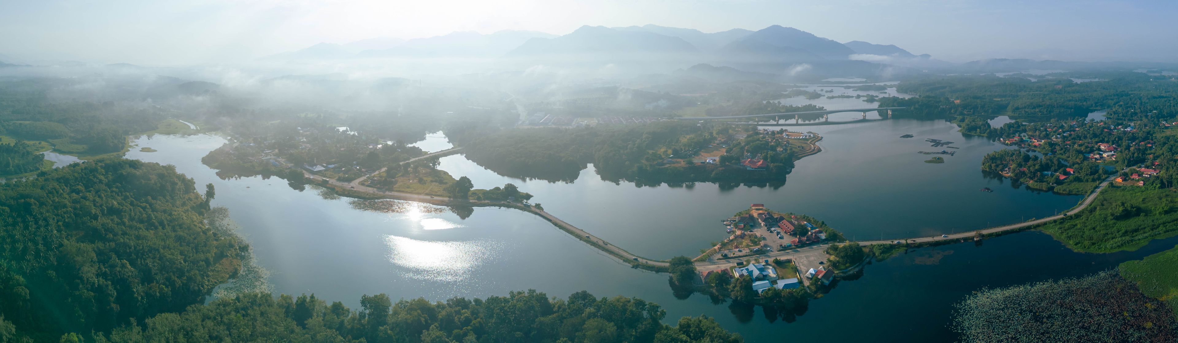 Panoramic aerial drone view of calm lake scenery at Tasik Raban or Raban Lake in Lenggong, Perak, Malaysia