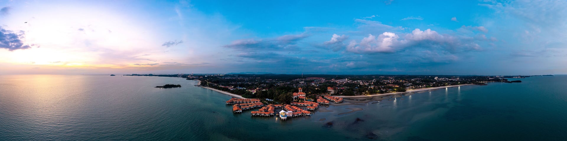 Avillion Port Dickson, with its over-water suites and villas at Pantai Saujana, during dusk