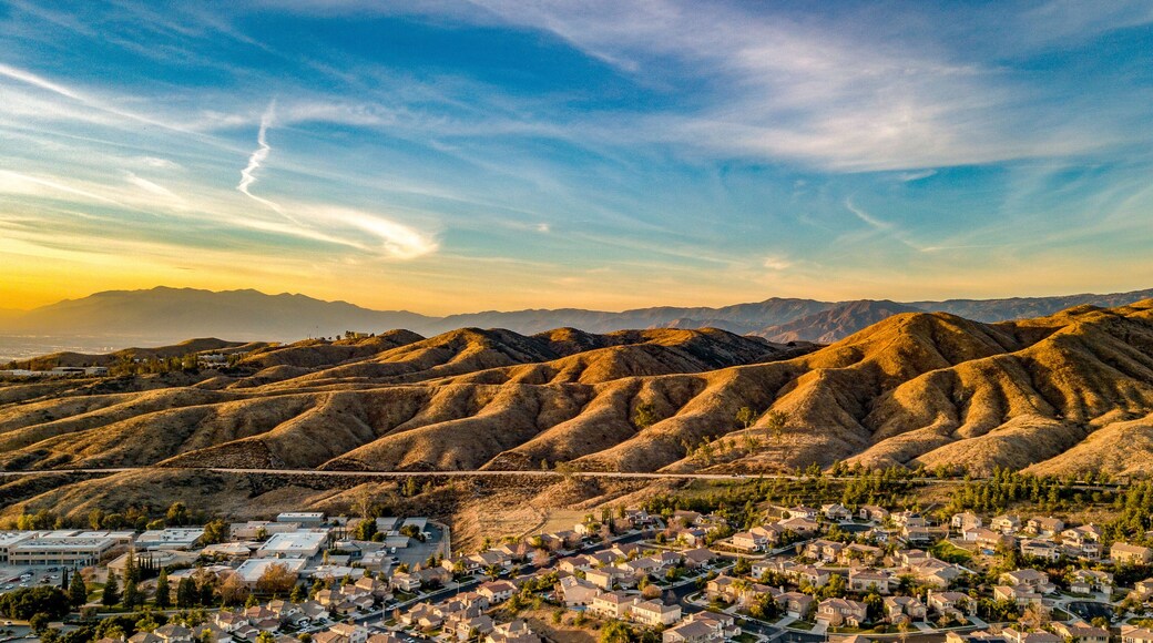 Beautiful Chapman Hills At Dusk With Blue and Yellow Sky And Wisps Of Clouds