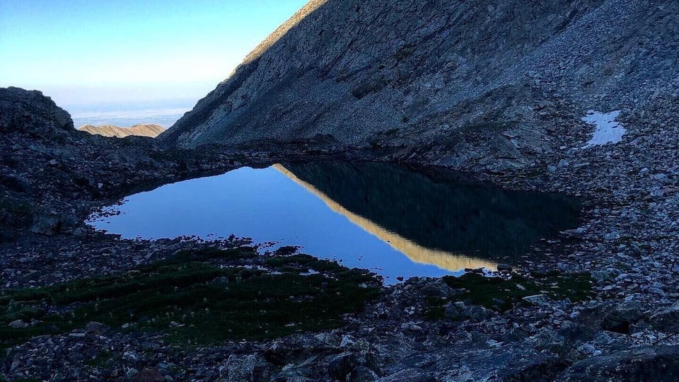 A mountain lake surrounded by rocky terrain.
