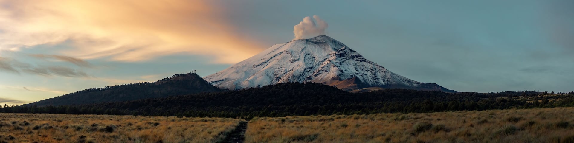 Crater fumarole among clouds of popocatepetl volcano in Mexico, panoramic view