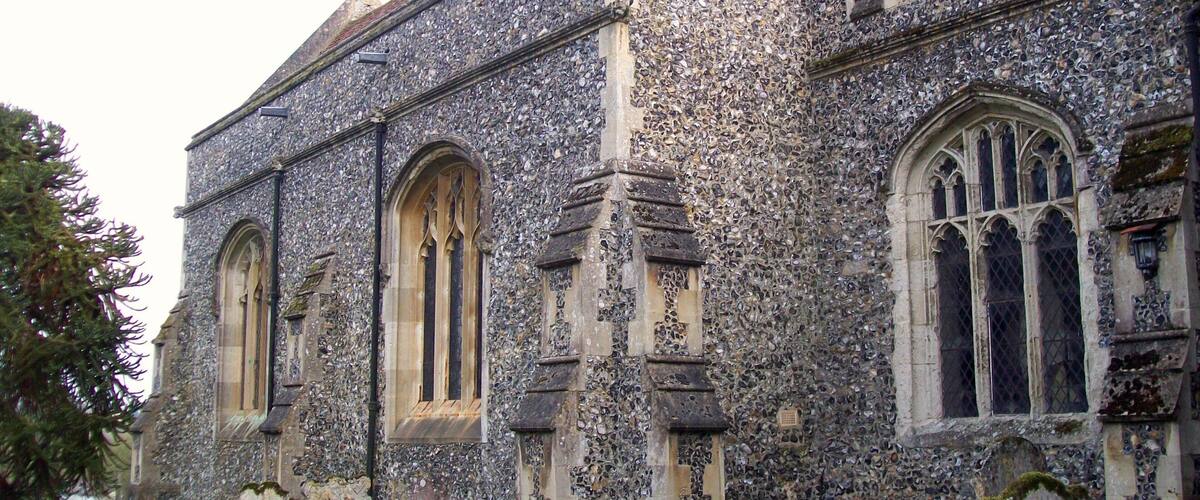 A historic church with Gothic architecture, featuring pointed arches and stained glass windows.