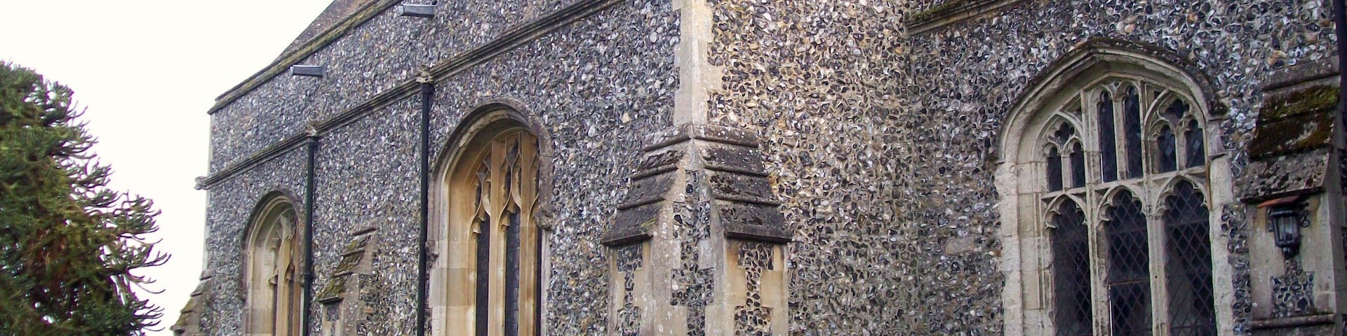 A historic church with Gothic architecture, featuring pointed arches and stained glass windows.