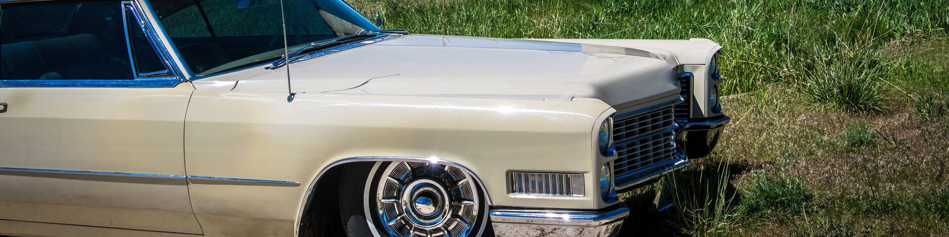 Lowered car in field with barn near elizabeth colorado
