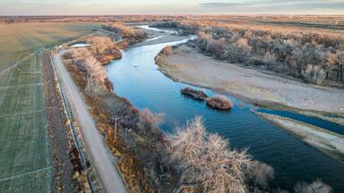 dusk over South Platte River in Colorado, aerial view with fall or winter scenery