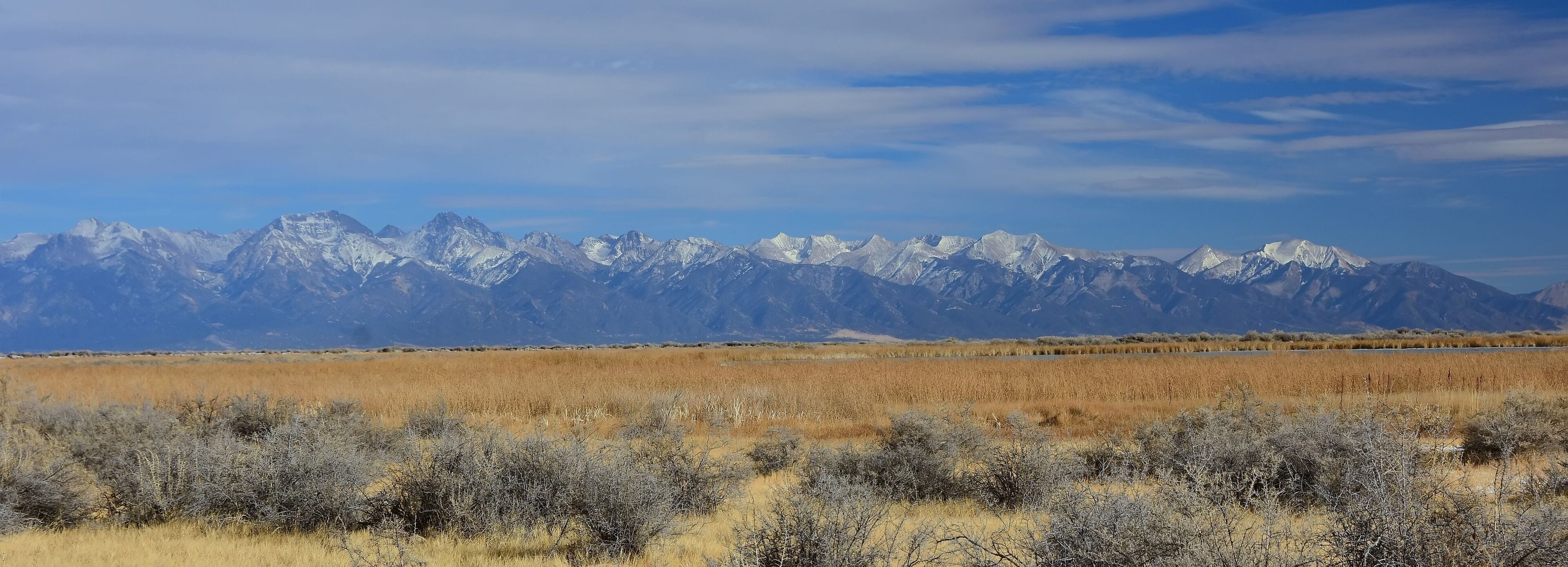 the spectacular sangre de cristo mountains  on a sunny winter day,  as seen from highway 285 in southern colorado, near moffat