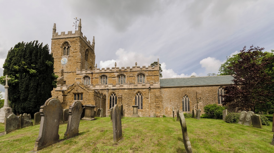 The church dates from the 12th century, and it was possible that there was a church before this time. It is situated on top of a hill with commanding views of the Wolds. It is built of Orange Ironstone with slate roofs, and consists of west tower, nave, north and south aisles, south porch and rectangular chancel. The tower is mid 12th century with an early 15th century fourth stage. There are four bells. There is a small early 12th century west doorway. There is also a round headed window of around 1175 with a small head inside the apex with weathered, drooping leaves on either side. The clock is from 1977. There is a 15th century Bell chamber with openings on four sides, the pinnacles are from 1881. The north aisle dates from the early 14th century, and there is a 16th century south porch. Inside there is a 12th century tower arch which was restored in 1884. The north and south arcades of four bays are mid 13th century with octagonal piers. There is a 15th century tie beam timber roof which was restored in the 19th and 20th centuries. The chancel arch is from the 13th century, the chancel itself contains two piscinas and several monuments. There is an interesting carved reredos reusing 16th C. carved panels. There is a 12th century octagonal stone font with a modern base. The church was restored in 1872, by James Fowler, and the tower was restored in 1881 to 1884. The church contains several memorials to various members of the Tennyson d'Eyncourt family of Bayons Manor, Charles Tennyson d'Eyncourt was uncle of Alfred Lord Tennyson.