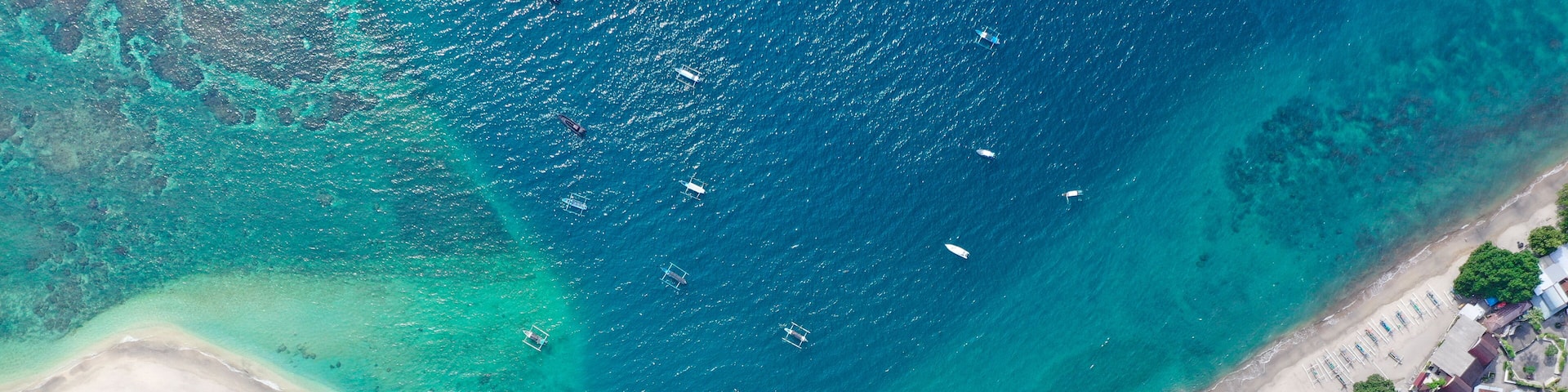 One of the most under-rated beaches in Indonesia. This amazing beach has a gecko shaped ferry terminal, uncrowded white sand beaches, great surf and snorkeling, the water is clean and cool with a shark tooth shaped deep water bay. good for SUP, locals & expats go to great lengths to keep it pollution and trash free