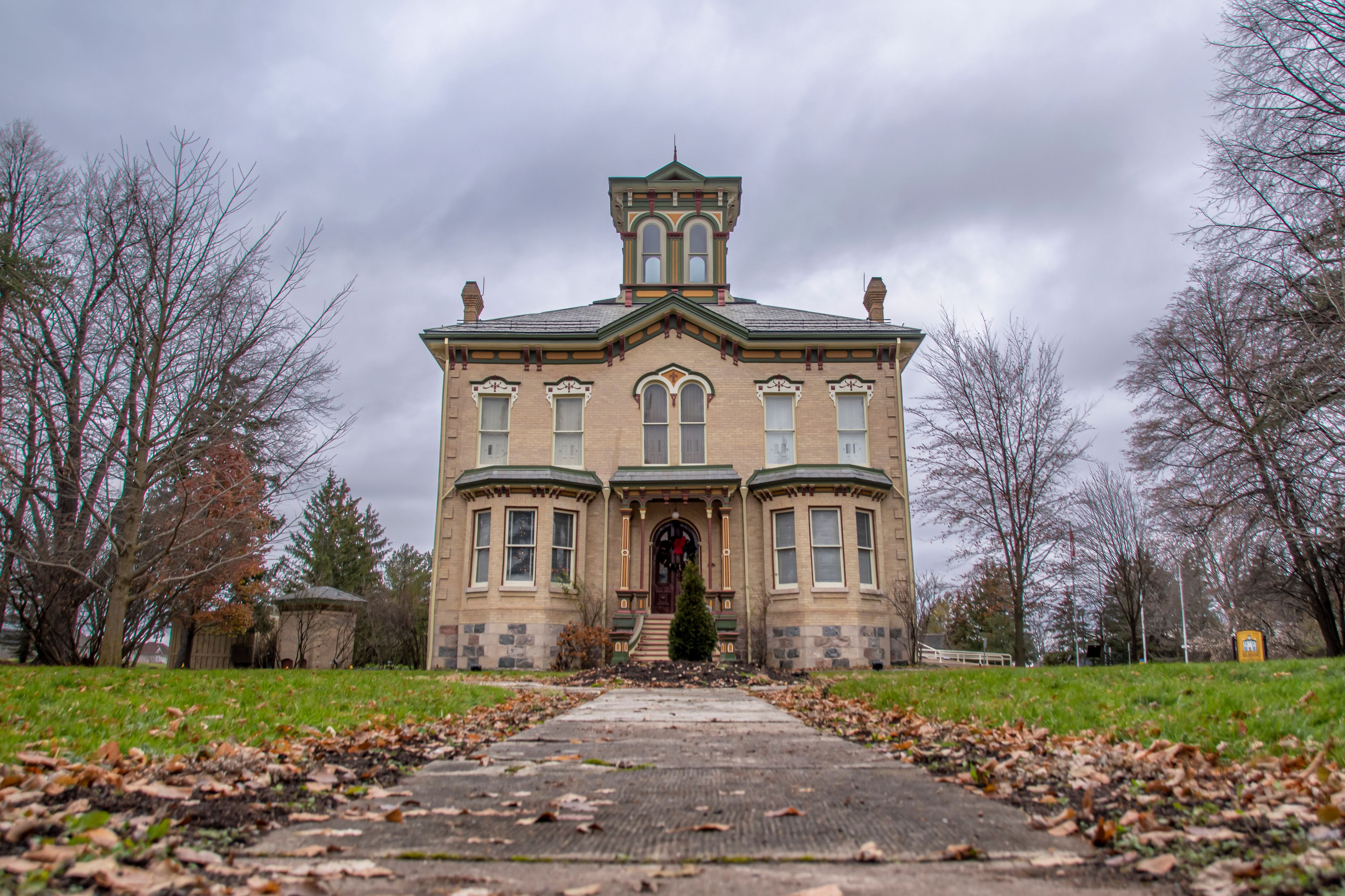 A large, historic building with a prominent tower and arched windows.