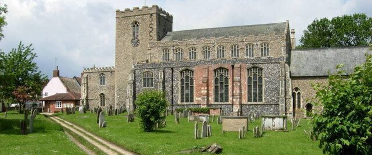 A church with a tower and a graveyard.
