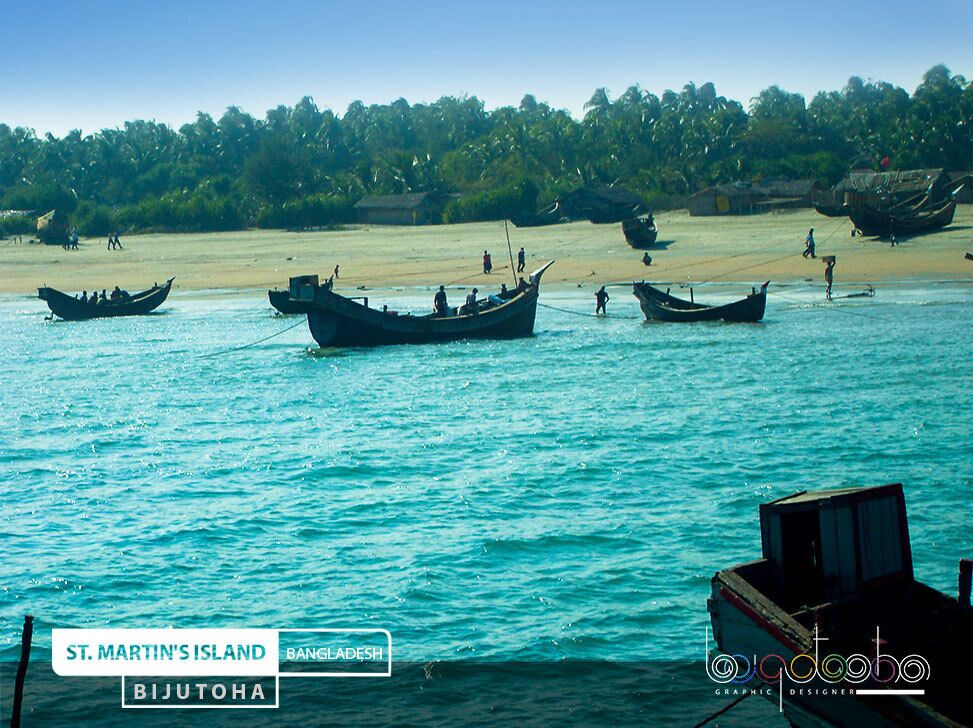 Boats on a turquoise sea with a sandy beach and dense greenery in the background.