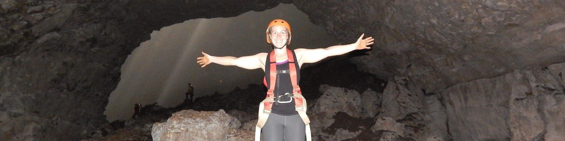 Goa Jomblang is an underground cave near Wonosari/Semanu, outside of Jogja, Indonesia. 
You rappel down about 40m, and then hike 200m until you arrive at this stunning light shining through this cave. This is right before you enter. 
Maybe the most beautiful place I've ever seen. Definitely worth the $35usd! You receive a team to set up the rappelling / lowering, safety briefings, guide for the hike, and lunch afterwards.