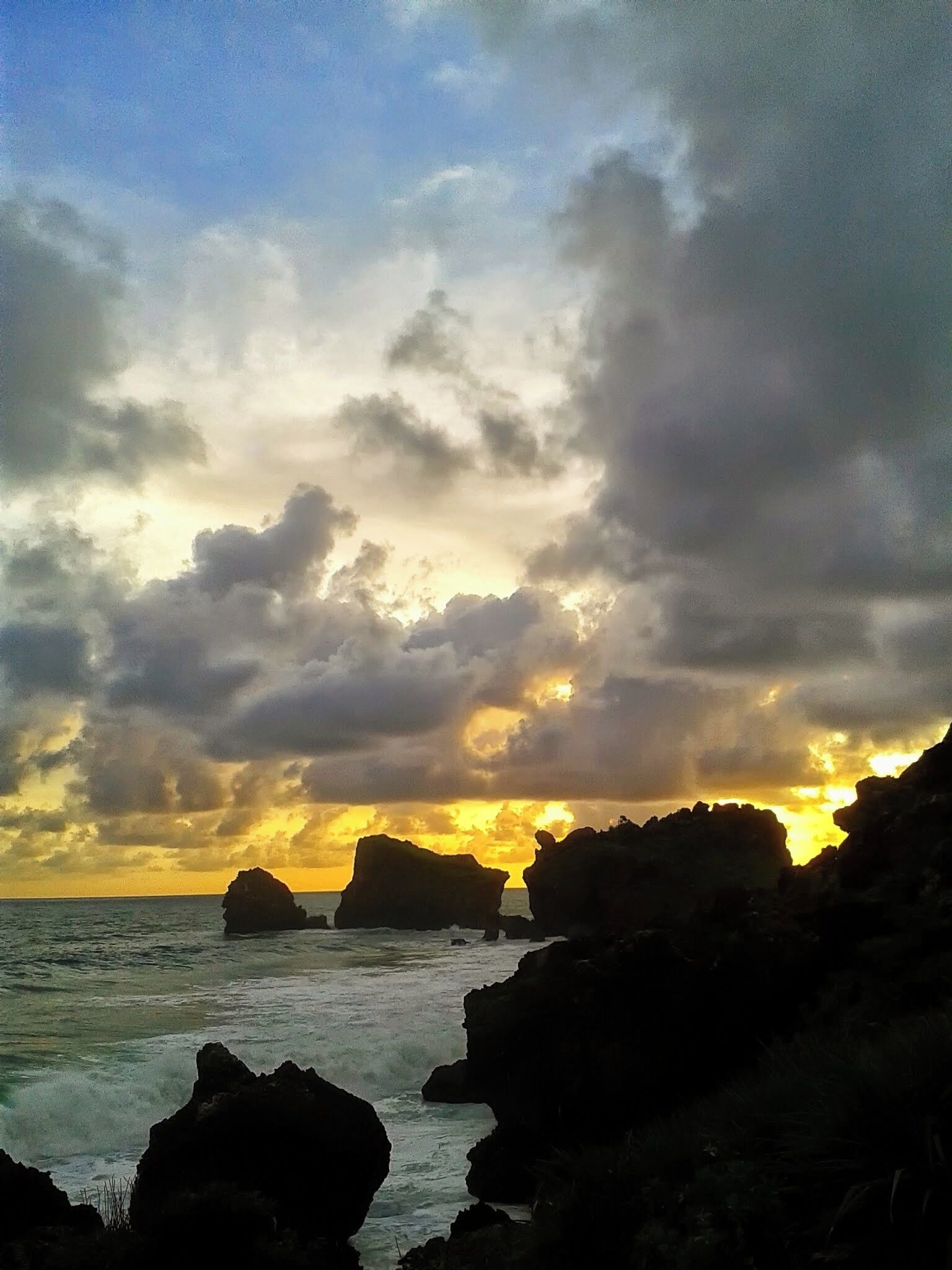 Sunset view from top of rocks of Siung Beach. January 2015.