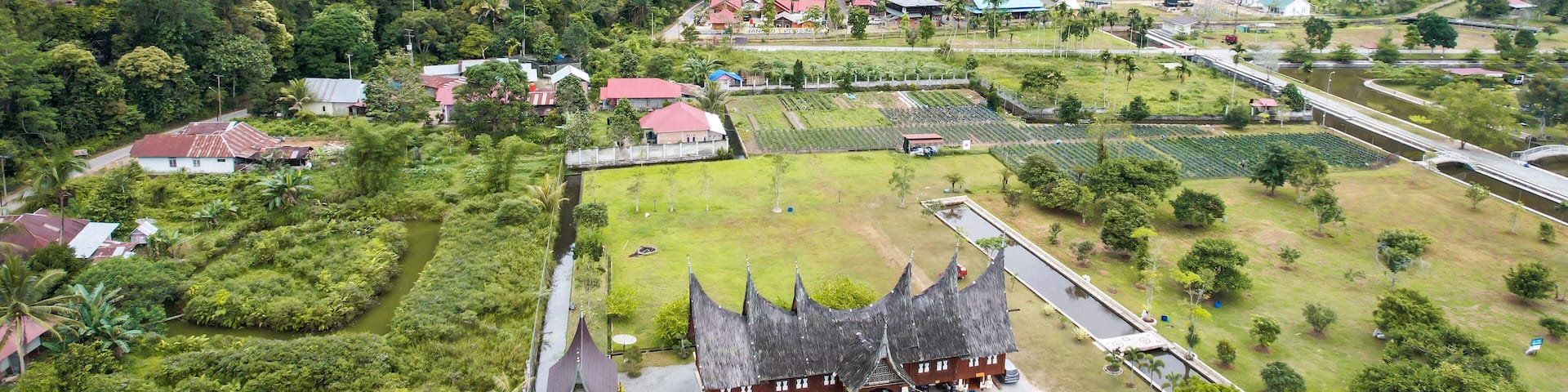 Aerial view of Minangkabau house or Rumah Gadang in a beautiful landscape view of Harau Valley with mountains valley and grass view, Beautiful Minangkabau.