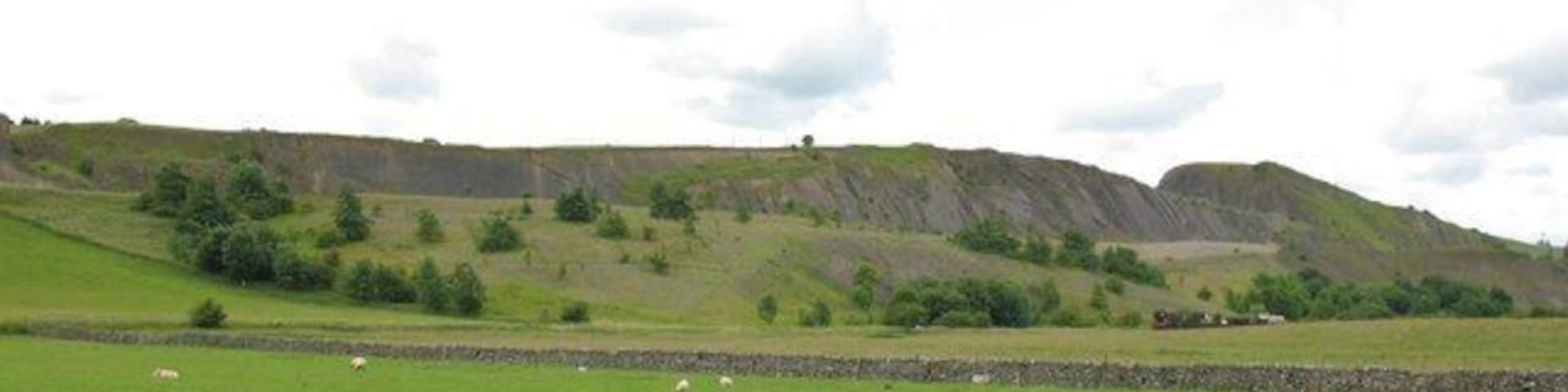 Haw Park Quarry This huge limestone quarry is now disused, apart from a section used for landfill. The typical horizontally bedded dales limestones are here turned almost vertical due to local faulting.