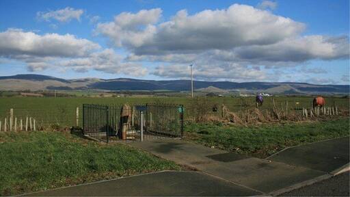 Roman Milestone (In Context) Adjacent to a layby on the A66. Dufton Pike can be seen in the far right distance between the two horses.