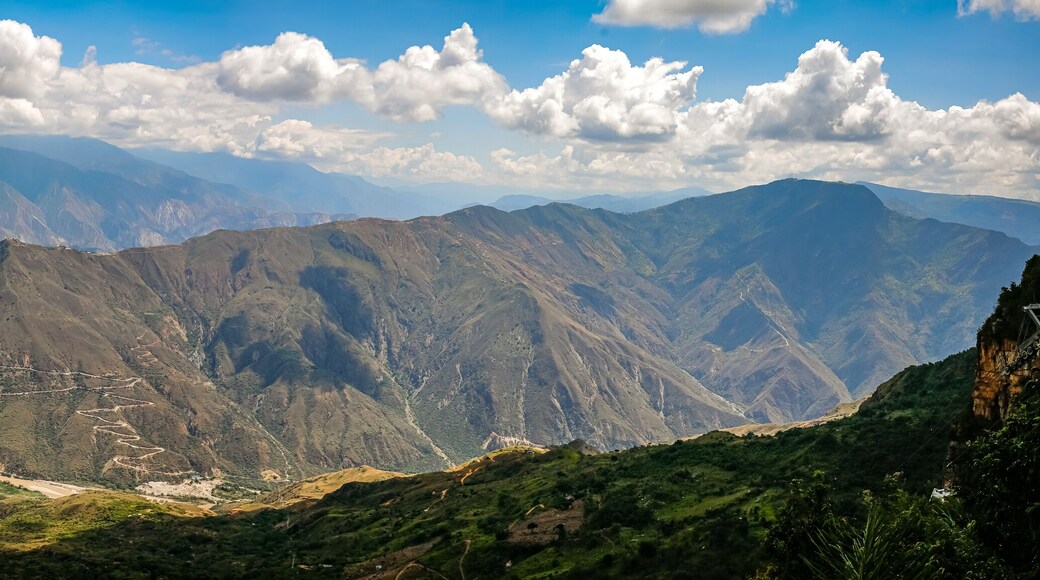 Impressive view to mountains and Chicamocha canyon with white clouds from Monument of the Virgin Mary at Chicamocha National Park, Colombia