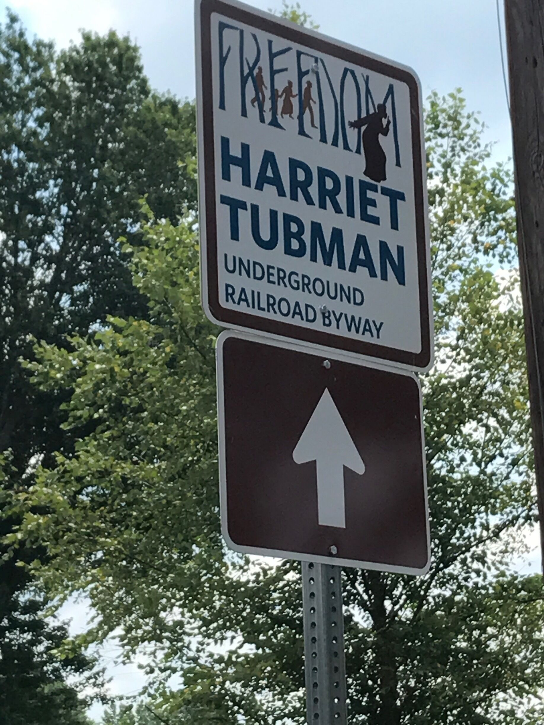 A sign for Harriet Tubman Underground Railroad Byway with a directional arrow.
