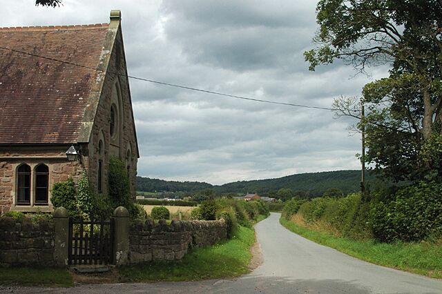 Lane to Moston The building on the left is now far more useful as a house than it ever was as a church.