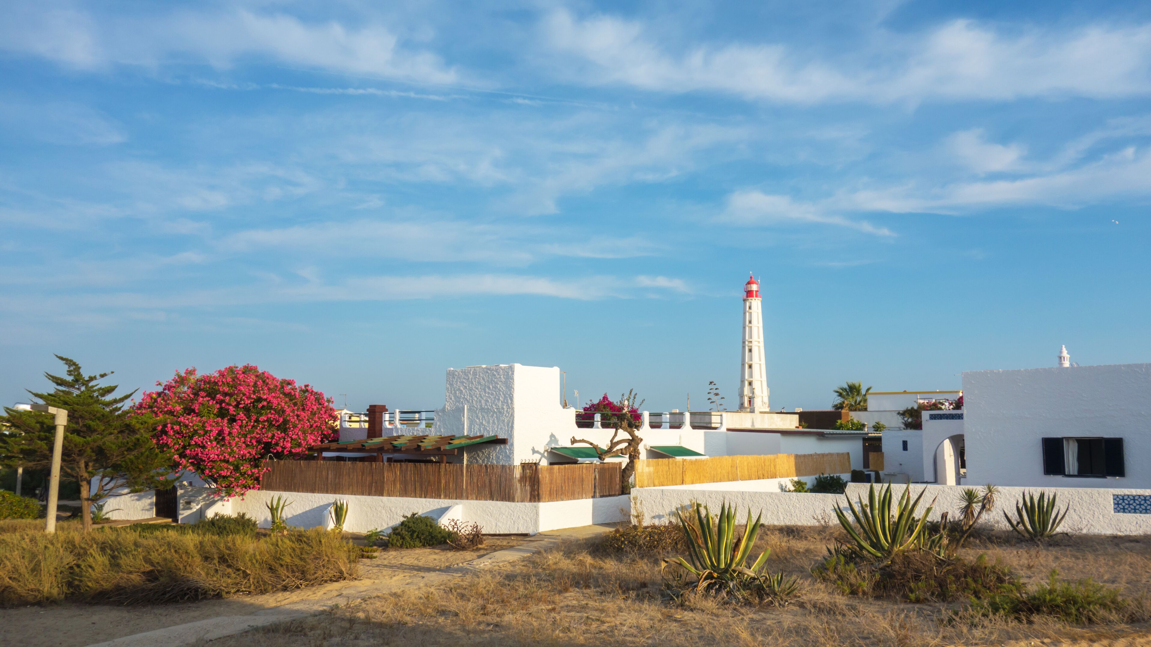 Lighthouse of Farol Island in Formosa Estuary, Algarve, Portugal.