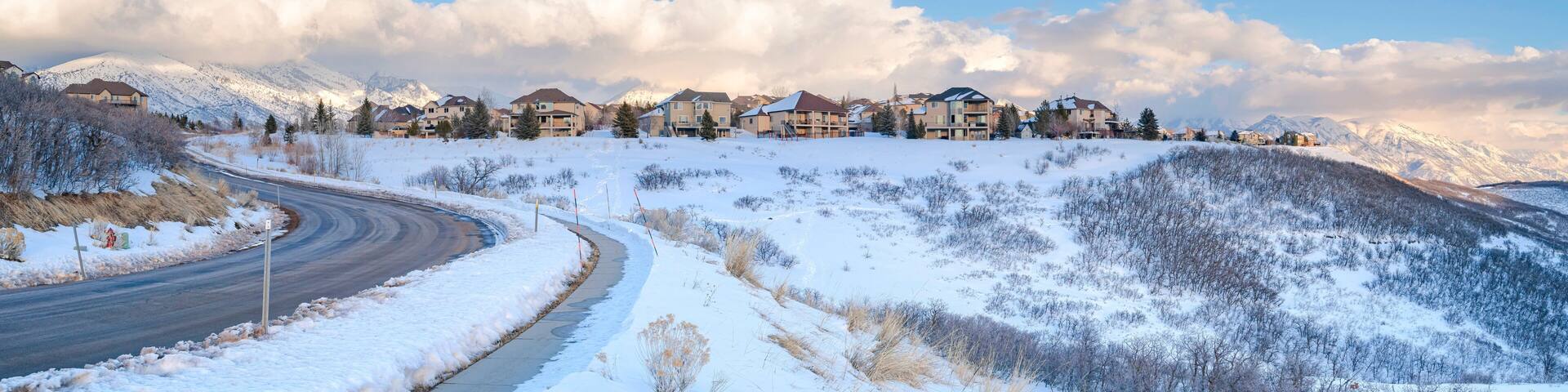 Houses on a snowy highland area at Draper, Utah with Mount Timpanogos view