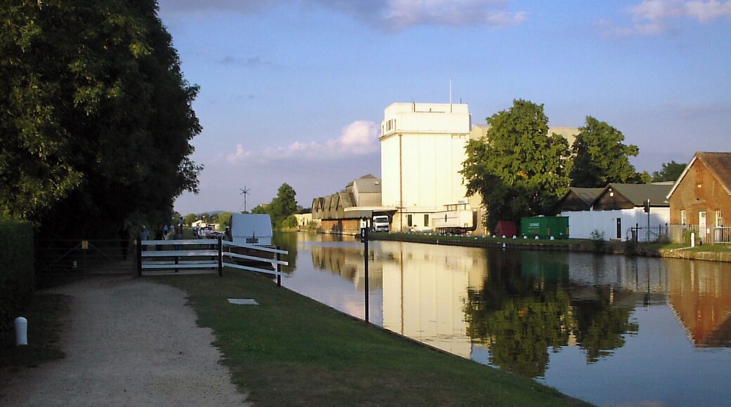 G&S Canal and former Cadbury's factory. Cadbury's opened a factory adjacent to the Gloucester & Sharpness canal near Fretherne Bridge in 1916. The factory produced chocolate crumb from ground cocoa beans, sugar, and milk from local farms before being transported to the Bournville factory in Birmingham by narrowboat. The silo in the centre of the picture was added later to provide additional storage. The factory is now occupied by several businesses including Shipton Mill.