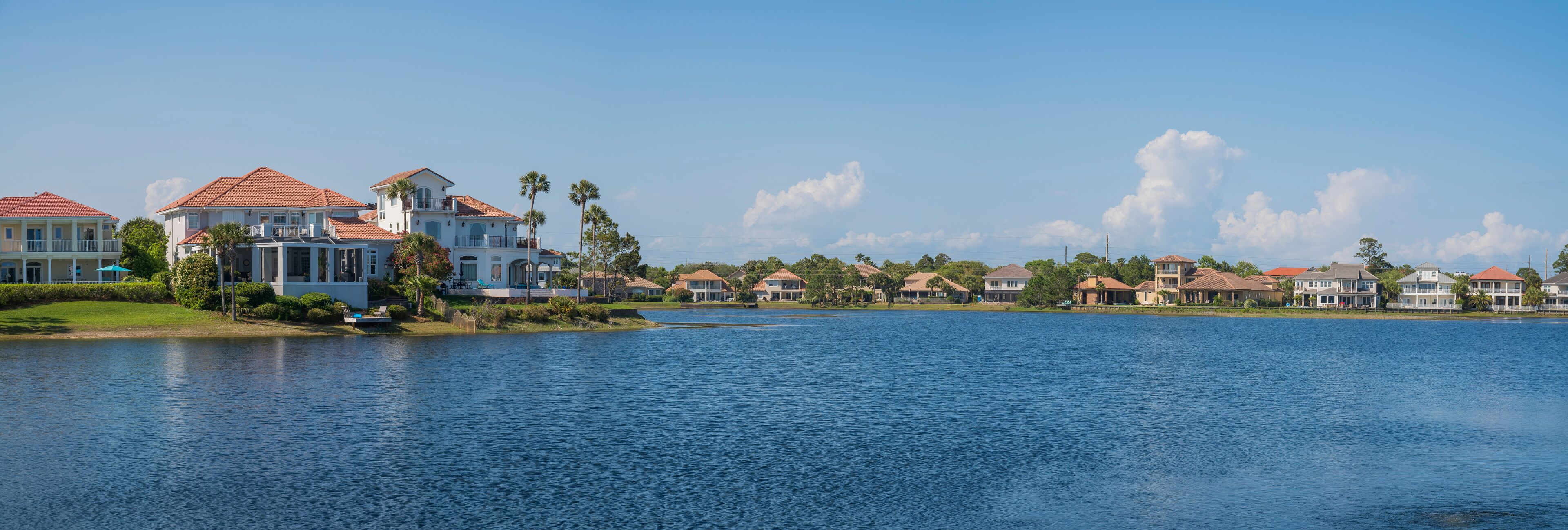 A waterfront community with houses and a lake.