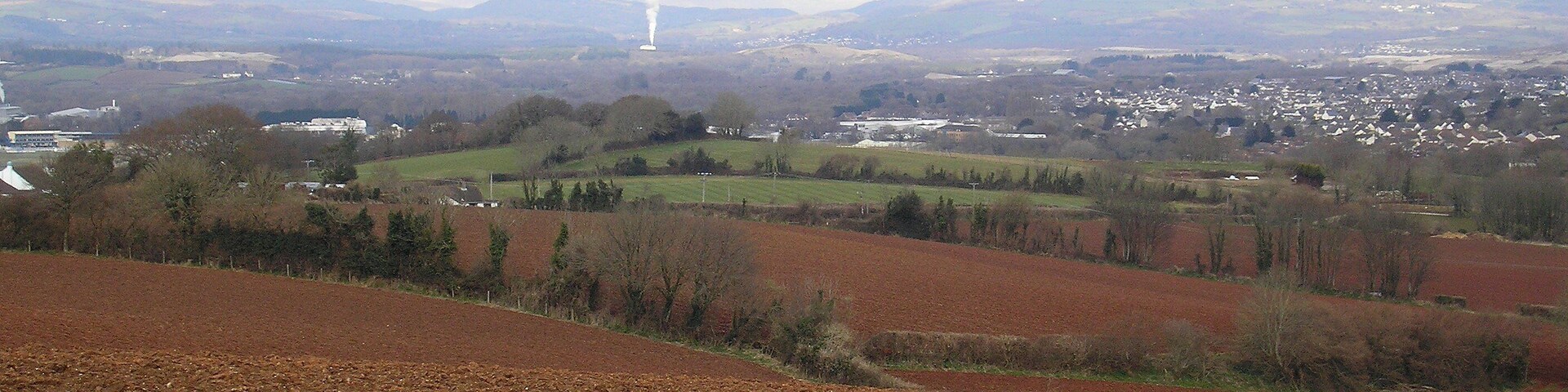 A view across the Teign Valley from Combeinteignhead. The Grandstand of Newton Abbot Racecourse can been seen on the far left of the picture. 19 March 2013. Camera: Olympus FE-120 6.0 Digital.