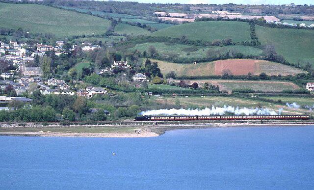 River Teign at Bishopsteignton with steam train passing. BR Standard Class 4MT 80098 working a 'Dawlish Donkey' service.