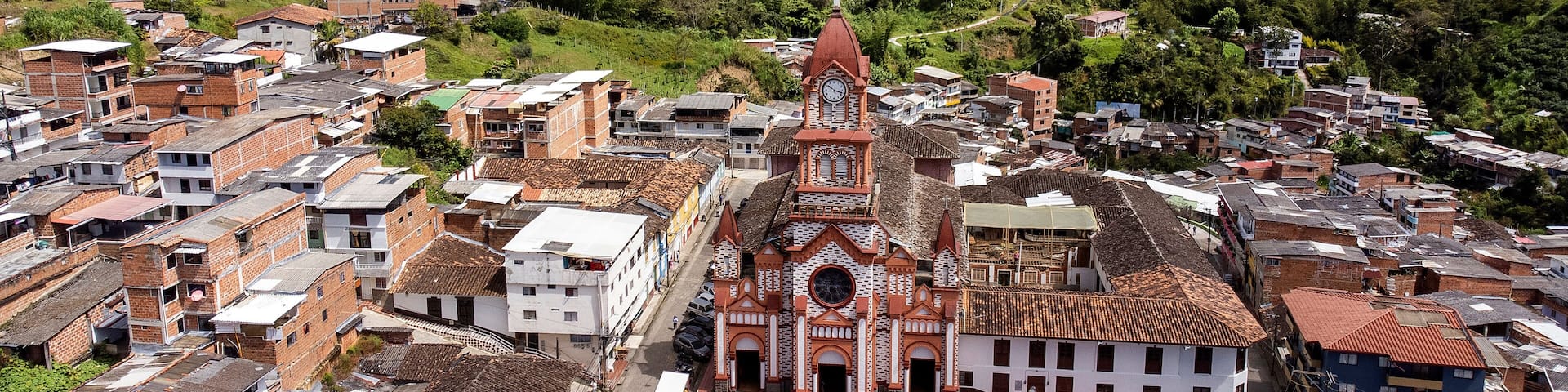 Granada, Antioquia - Colombia. June 28, 2025. Panoramic drone view of the town's main church