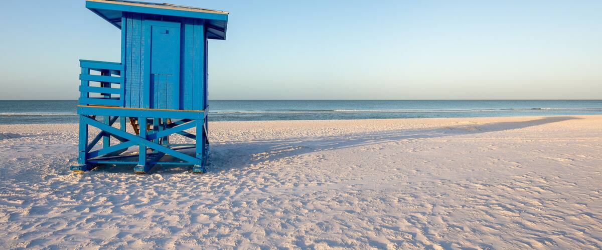 Blue Lifeguard Tower on a Morning Beach