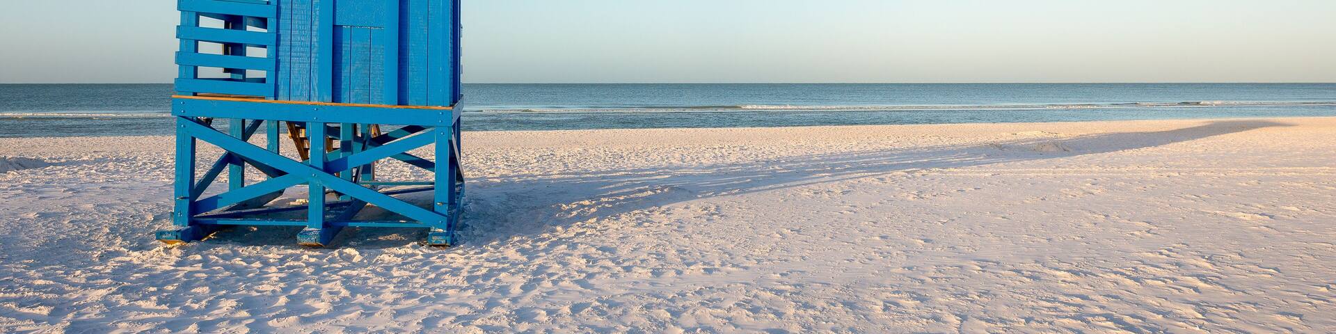 Blue Lifeguard Tower on a Morning Beach